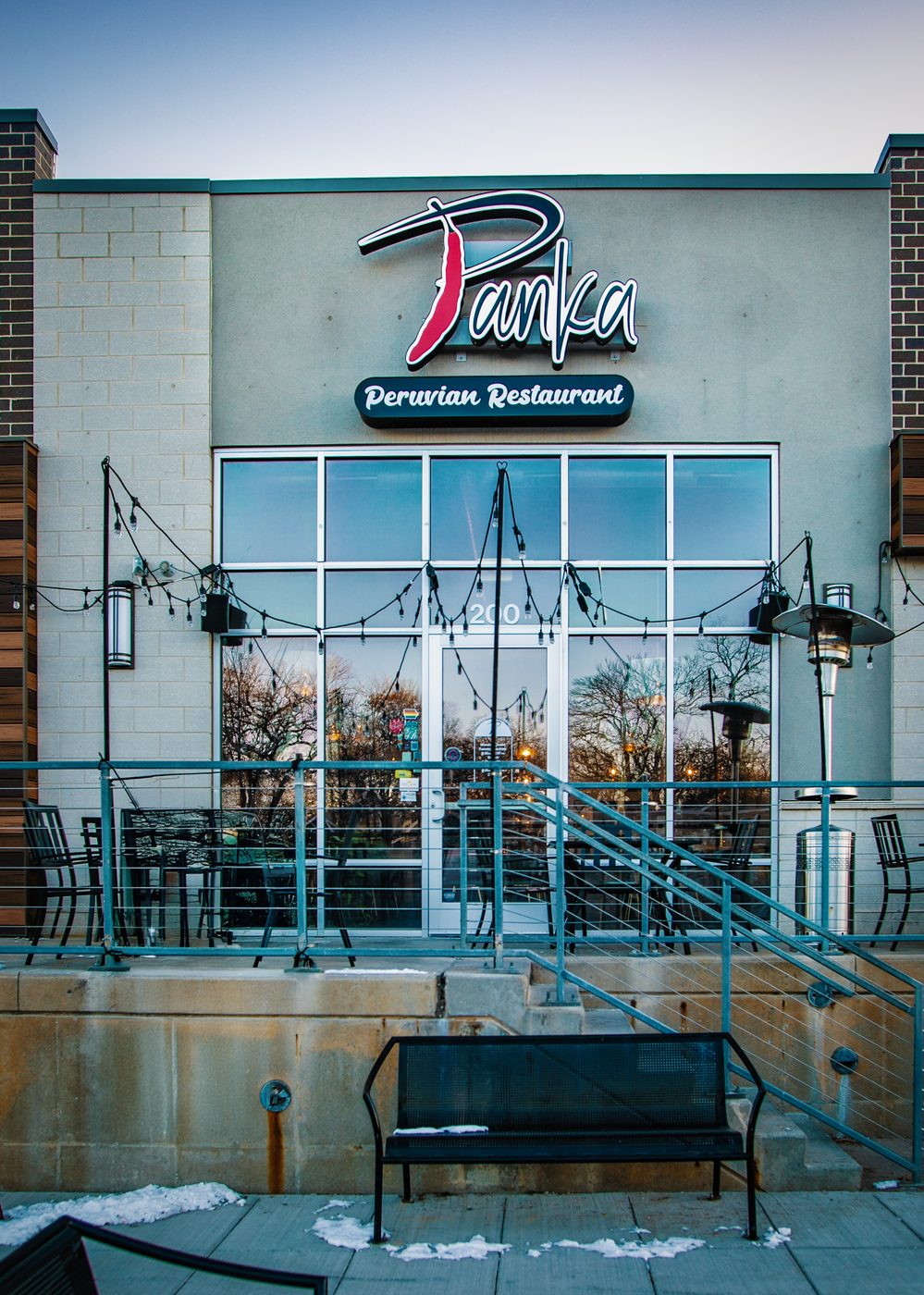 The Panka Peruvian Restaurant storefront on Ingersoll Avenue at dusk.